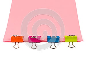 Four clips on office paper