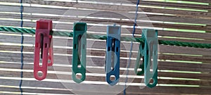 Four clothes pins on the clothesline