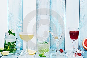 Four cocktail over wooden blue background