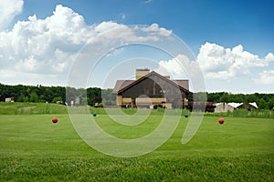 Four color balls on golf course, launching pad