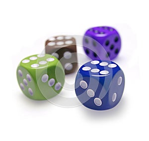 Four colored dice each with the figure 6 in the upper face - concept of success