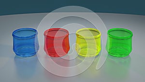 FOUR COLORED GLASSES ON REFLECTIVE TABLE