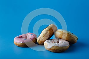 Four colorful donuts