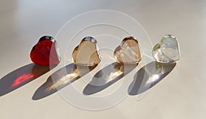 Four Colorful Glass Hearts  on a White Background