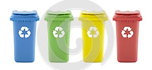 Four colorful recycle bins