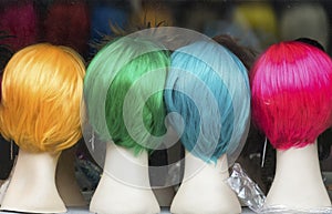 Four colorful wigs in Milan