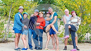 Four couples of beautiful elderly tourists having
