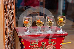 Four cups of tea made from different flower tea