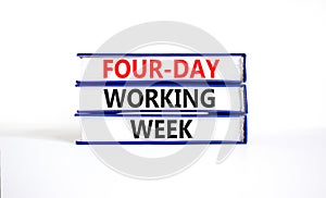 Four-day working week symbol. Concept words Four-day working week on books on a beautiful white table white background. Business