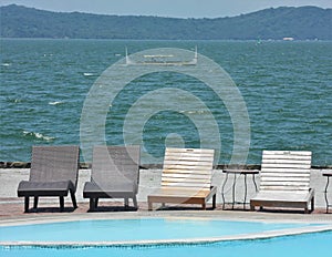 Four Deck Chairs by the Pool with Lake Taal at the background