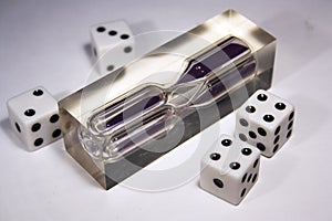 Four dice and an hourglass