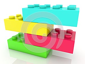 Four different colored toy bricks on top of each other