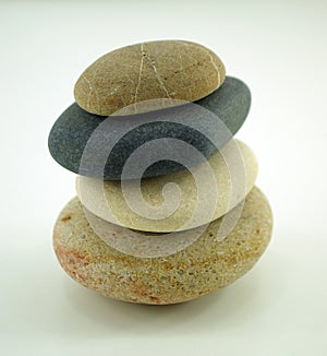 four different zen stones on white