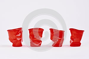 Four disposable plastic cups