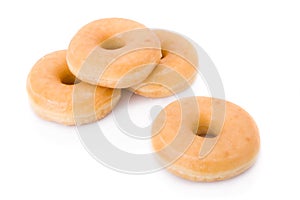 Four doughnuts or donuts piled photo