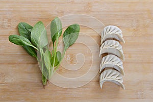 Four dumplings and spinach