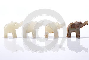 Four dwarf elephant statuettes