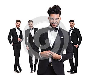 Four elegant man with leader buttoning his tux in front