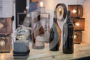 Four Empty Dark Glass Bottles with Corks