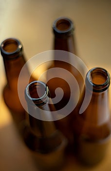 Four empty glass beer bottles.