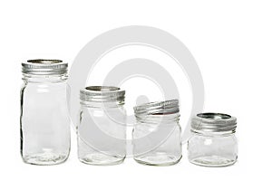 Four empty glass jar