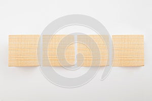 Four empty wooden cubes on a white background