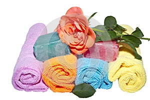Four facecloth rolls various shades soaps and rose