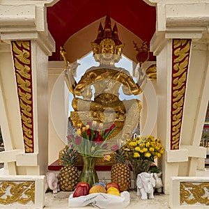 Four-faced Buddha statue in a pavilion at the Buddhist Center of Dallas, Texas.