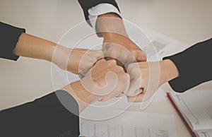 Four Fist bump in meeting for team concept