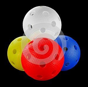 Four floorball balls isolated