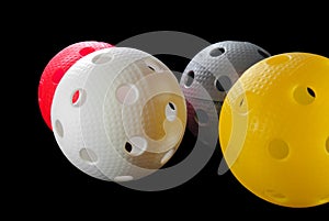 Four floorball balls isolated