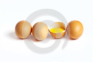 Four fresh eggs are located on a white background