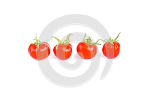 Four fresh juicy red cherry tomatoes in line, organic food ingredient, close up, isolated on white background