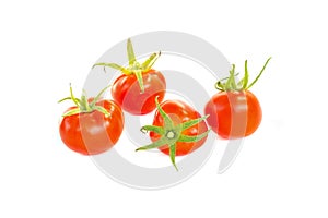 Four fresh juicy red cherry tomatoes, organic food ingredient, close up, isolated on white background