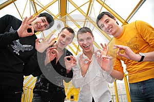 Four friends with fingers ok