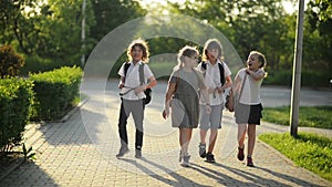 Four Friends Are Going to School. They Have A Lot of Fun Because Today is Their First Day at School.