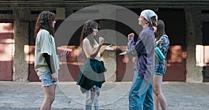 Four friends meet at a housing estate for dance training. The girls play paper rock and scissors by drawing music, duets