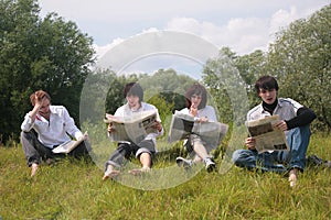 Four friends read newspapers