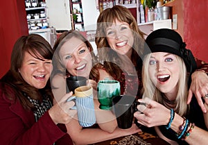 Four girlfriends at a bistro photo