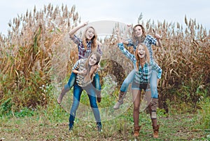 Four girlfriends playing horses and having fun in