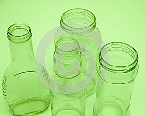 Four glass bottles and jars for recycling