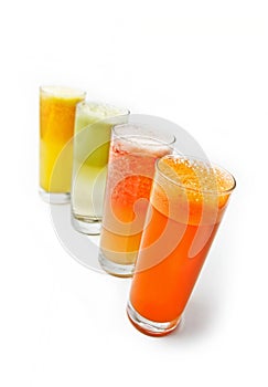 Four glasses of different fresh juice