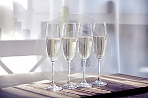 Four glasses of wine on a dining table