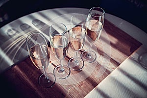 Four glasses of wine on a dining table