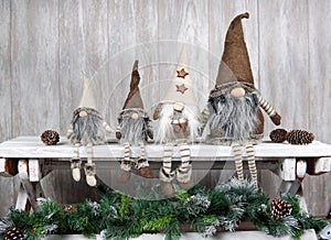 Four gnomes on the bench. The concept of the family. Christmas