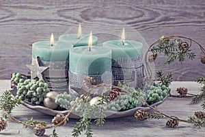 Four green christmas candle