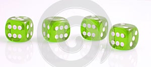 Four green dice