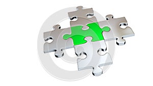 Four Grey Puzzle Pieces encircle One Green Piece photo