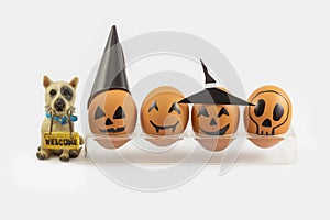 Four halloween egg in egg cup and wellcome dog photo