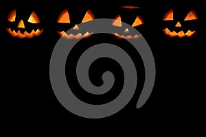 Four halloween pumpkins background